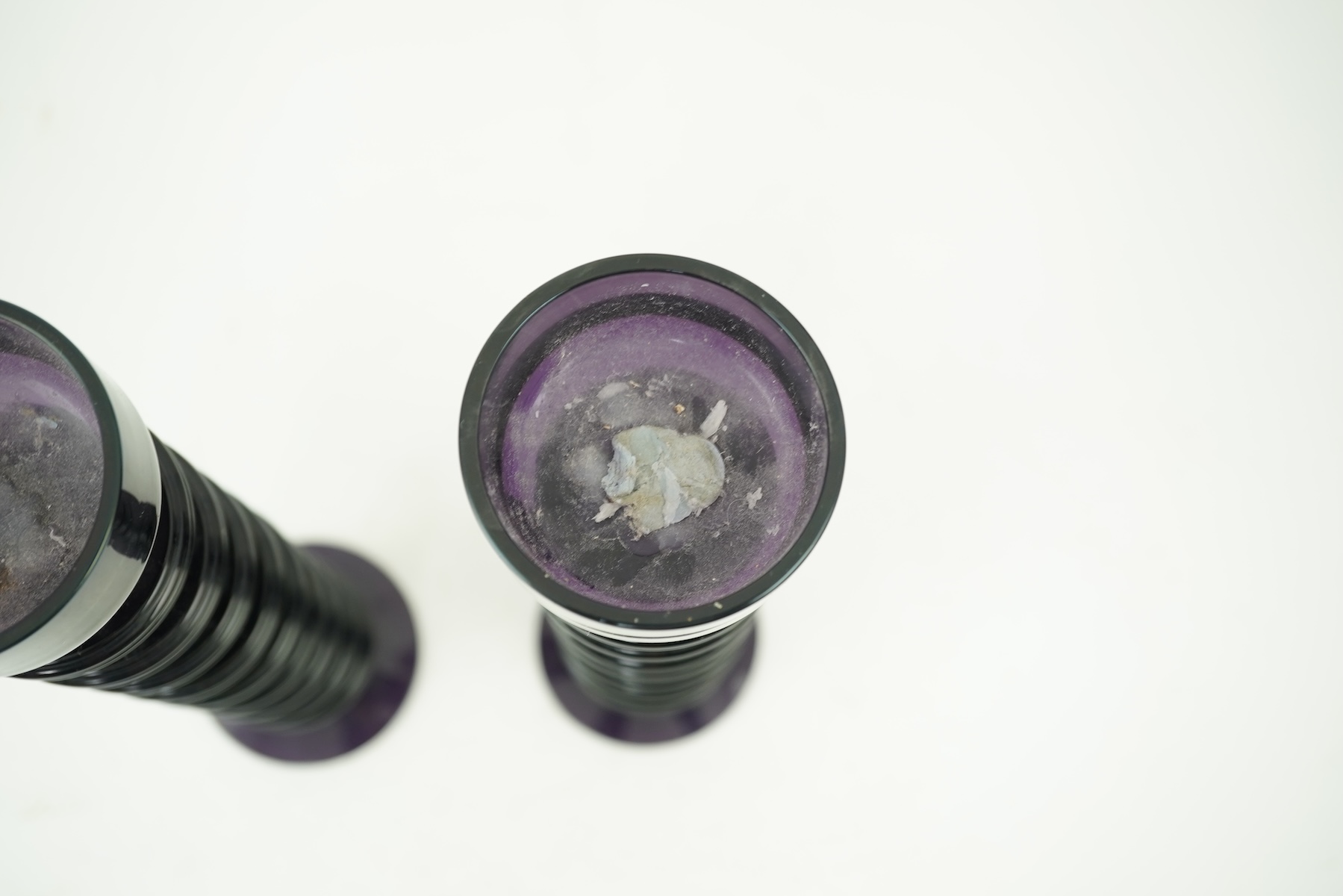 Ronald Stennett-Wilson (1915-2009) for Wedgwood: A pair of nine-ring 'Sheringham' amethyst glass candlesticks